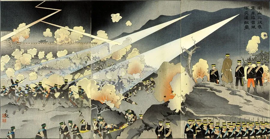 Colour woodblock triptych of Japanese infantry charging a hill in shell bursts under a stormy sky, two searchlight beams across them